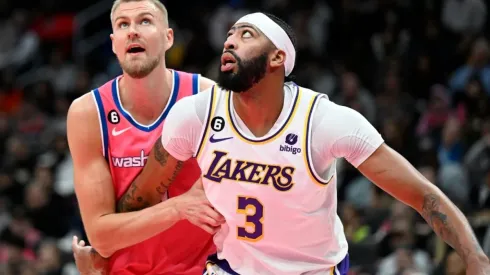 Kristaps Porzingis of the Washington Wizards defends Anthony Davis of the Los Angeles Lakers