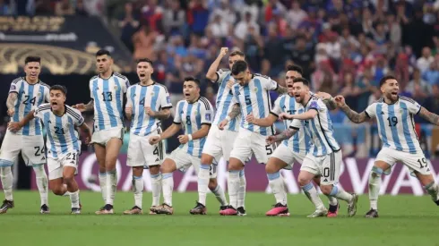 Lionel Messi of Argentina celebrates with teammates in the penalty shootout during the FIFA World Cup Qatar 2022.