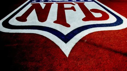 The Arizona Cardinals mascot, Big Red, runs on the field in a Santa Claus costume