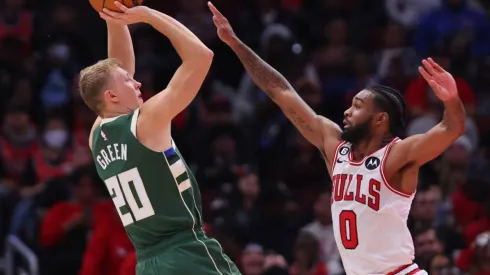 AJ Green of the Milwaukee Bucks shoots over Coby White of the Chicago Bulls