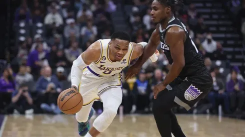 Russell Westbrook #0 of the Los Angeles Lakers drives to the basket against Davion Mitchell #15 of the Sacramento Kings
