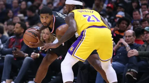 Paul George #13 of the LA Clippers is guarded by Patrick Beverley #21 of the Los Angeles Lakers