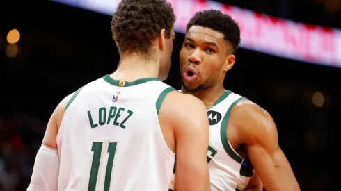 Brook Lopez #11 reacts with Giannis Antetokounmpo #34 of the Milwaukee Bucks
