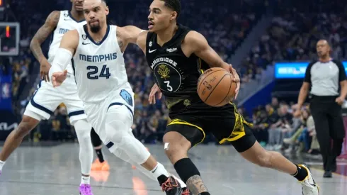 Jordan Poole #3 of the Golden State Warriors drives to the basket past Dillon Brooks #24 of the Memphis Grizzlies
