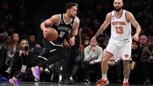 Ben Simmons #10 of the Brooklyn Nets drives against Evan Fournier #13 of the New York Knicks
