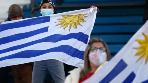 Fans of Uruguay wave flags
