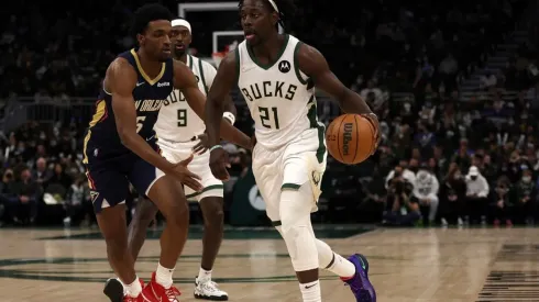 Jrue Holiday #21 of the Milwaukee Bucks drives around Herbert Jones #5 of the New Orleans Pelicans
