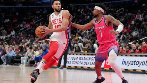 Ben Simmons #10 of the Brooklyn Nets drives to the hoop as Jordan Goodwin #7 of the Washington Wizards
