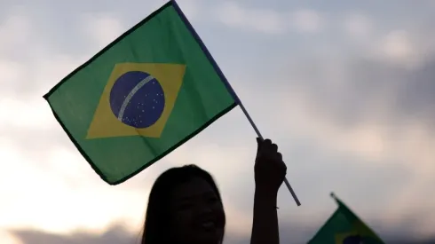 Fans wave a Brazil flag
