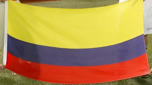Children hold the flag of Colombia