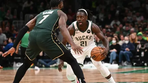 Jrue Holiday #21 of the Milwaukee Bucks dribbles the ball against Jaylen Brown #7 of the Boston Celtics