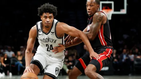 Cam Thomas #24 of the Brooklyn Nets dribbles as Jamaree Bouyea #11 of the Miami Heat
