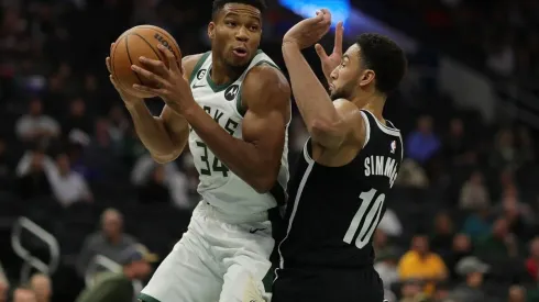 Giannis Antetokounmpo #34 of the Milwaukee Bucks is defended by Ben Simmons #10 of the Brooklyn Nets
