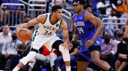 Giannis Antetokounmpo #34 of the Milwaukee Bucks drives to the basket against Wendell Carter Jr. #34 of the Orlando Magic
