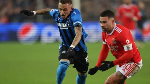 Noa Lang of Club Brugge is tackled by Nicolas Otamendi of Benfica