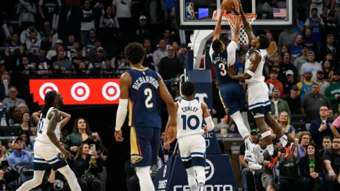 Anthony Edwards #1 of the Minnesota Timberwolves blocks a shot by CJ McCollum #3 of the New Orleans Pelicans
