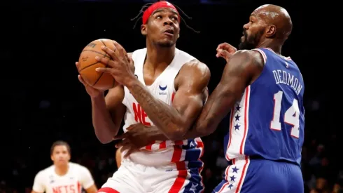 Day'Ron Sharpe #20 of the Brooklyn Nets goes to the basket as Dewayne Dedmon #14 of the Philadelphia 76ers defends
