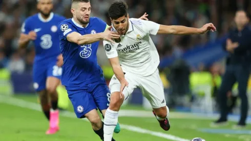 Marco Asensio of Real Madrid is challenged by Mateo Kovacic of Chelsea
