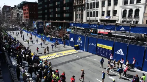 Runnings make their way down Boylston street to the finish line during the 126th Boston Marathon
