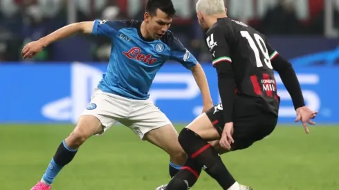 Hirving Lozano of SSC Napoli battles for possession with Theo Hernandez of AC Milan