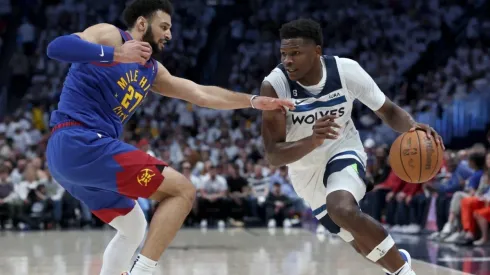 Anthony Edwards #1 of the Minnesota Timberwolves drives against Jamal Murray #27 of the Denver Nuggets
