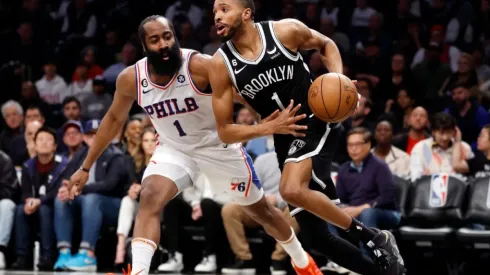 Mikal Bridges #1 of the Brooklyn Nets dribbles against James Harden #1 of the Philadelphia 76ers
