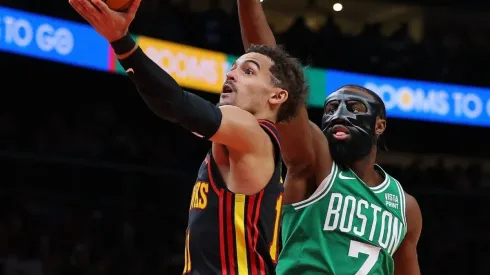 Trae Young #11 of the Atlanta Hawks drives against Jaylen Brown #7 of the Boston Celtics
