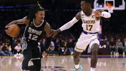 Ja Morant #12 of the Memphis Grizzlies drives to the basket on Dennis Schroder #17 of the Los Angeles Lakers
