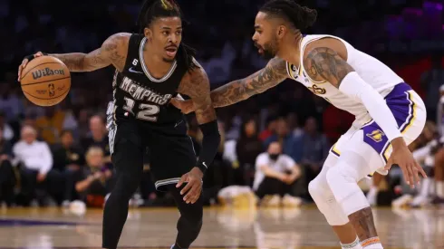 Ja Morant #12 of the Memphis Grizzlies dribbles in front of D'Angelo Russell #1 of the Los Angeles Lakers