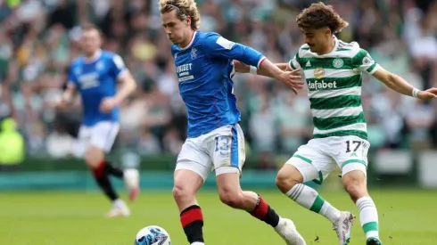 Todd Cantwell of Rangers FC is put under pressure by Jota of Celtic
