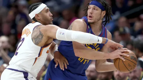 Aaron Gordon #50 of the Denver Nuggets is guarded by Ish Wainright #12 of the Phoenix Suns
