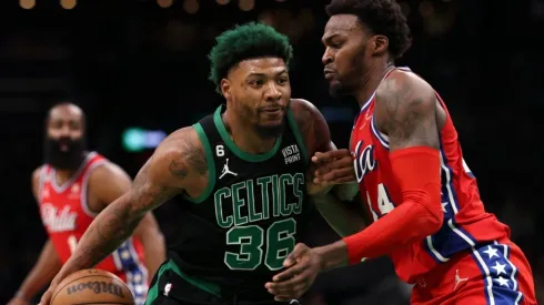 Marcus Smart #36 of the Boston Celtics dribbles against Paul Reed #44 of the Philadelphia 76ers
