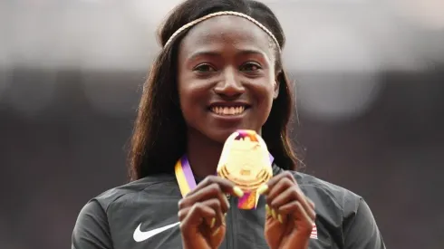 Tori Bowie poses with the gold medal for the Women's 100 meters at IAAF World Athletics Championships London 2017
