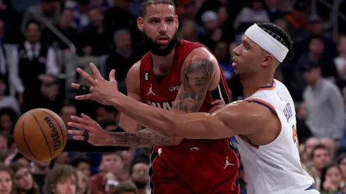 Caleb Martin #16 of the Miami Heat tries to pass as Josh Hart #3 of the New York Knicks
