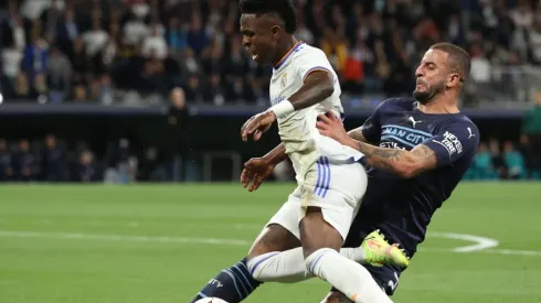 Kyle Walker of Manchester City FC tackles Vinicius Junior (L) of Real Madrid CF