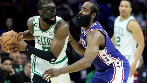 Jaylen Brown #7 of the Boston Celtics looks to pass against James Harden #1 of the Philadelphia 76ers
