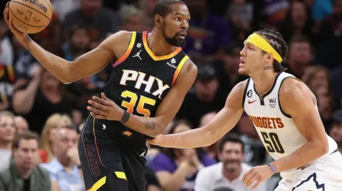 Kevin Durant #35 of the Phoenix Suns handles the ball against Aaron Gordon #50 of the Denver Nuggets