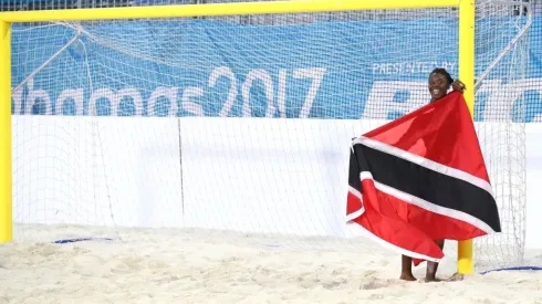 Young trinidadian with the flag of Trinidad and Tobago
