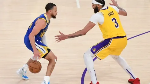 Stephen Curry #30 of the Golden State Warriors dribbles the ball against Anthony Davis #3 of the Los Angeles Lakers
