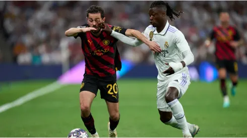 Bernardo Silva of Manchester City is challenged by Eduardo Camavinga of Real Madrid
