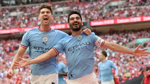 Ilkay Gundogan of Manchester City celebrates with teammate John Stones after scoring the team's second goal during the 2023 FA Cup Final
