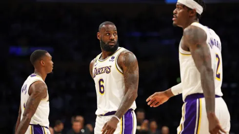 LeBron James #6, Lonnie Walker IV #4 and Jarred Vanderbilt #2 of the Los Angeles Lakers leave the court.
