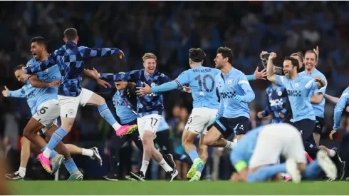 Manchester City players and staff celebrate after the team's victory in the UEFA Champions League 2022/23 final
