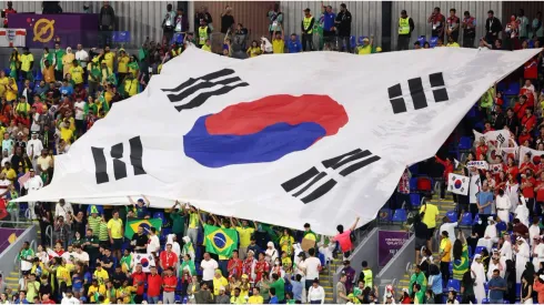 Fans hold a giant Korea Republic flag