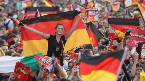 Fans wave German flags
