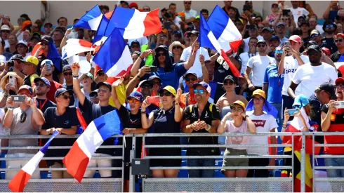 Fans wave France flags
