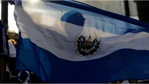 El Salvador fan waves a flag
