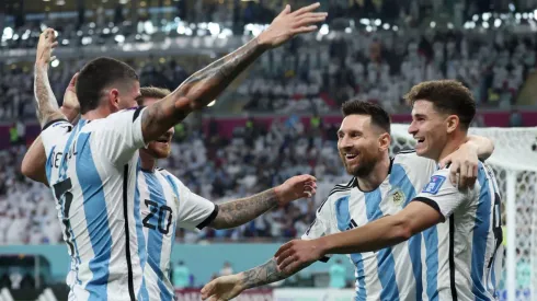 Lionel Messi celebrates with Argentine teammates at Qatar 2022
