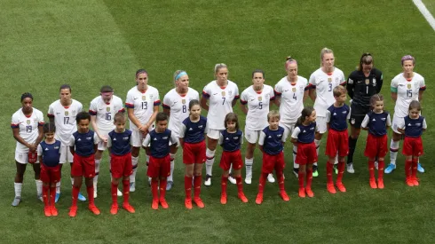 USWNT walk out with children
