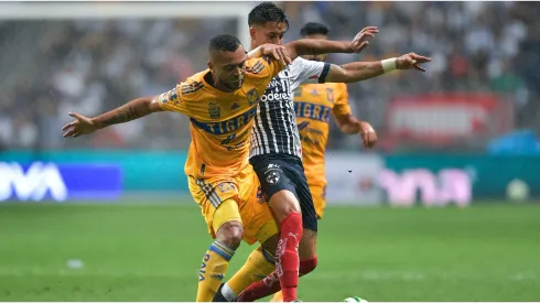 Maximiliano Meza of Monterrey fights for the ball with Rafael De Souza of Tigres
